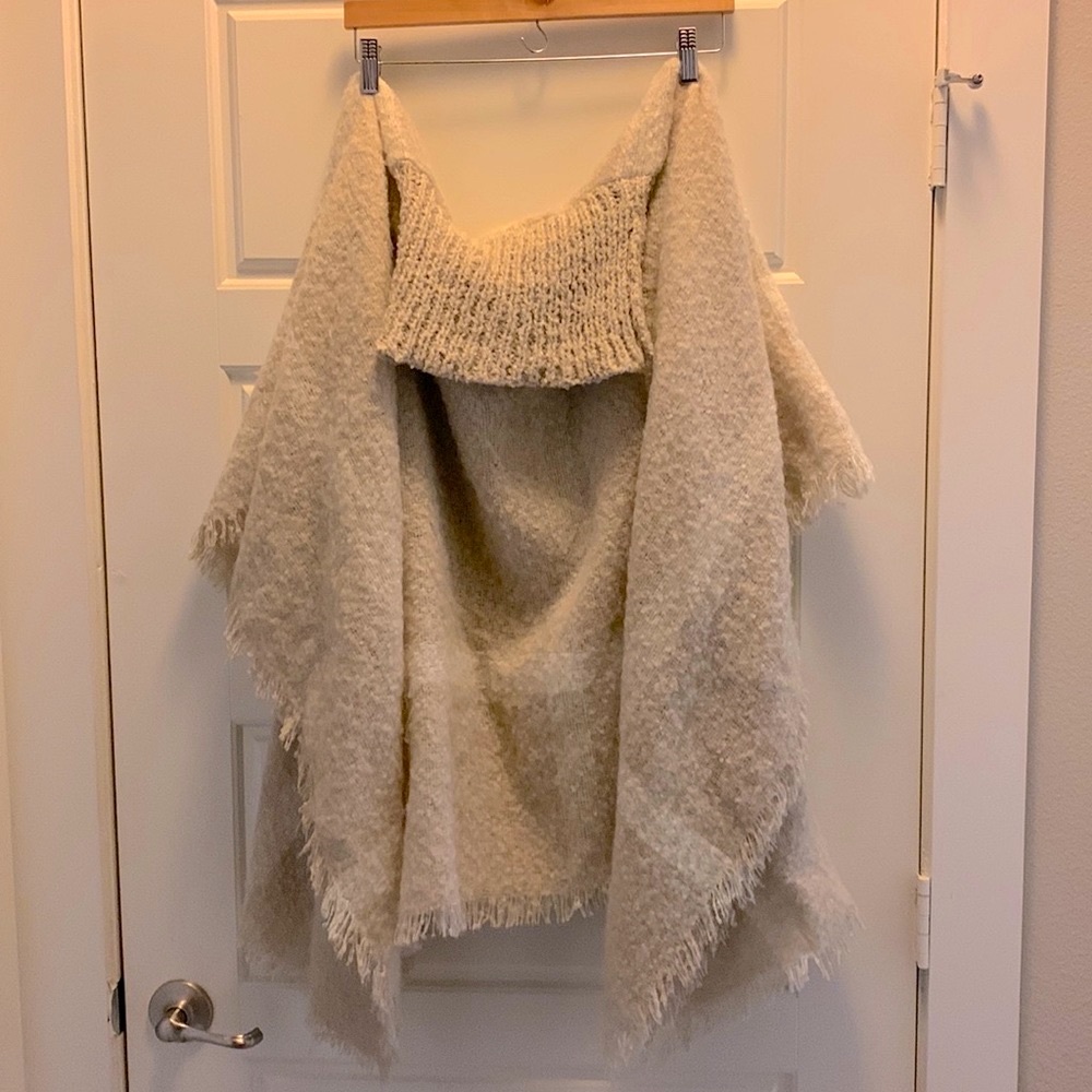 Cream shawl with turtle neck.